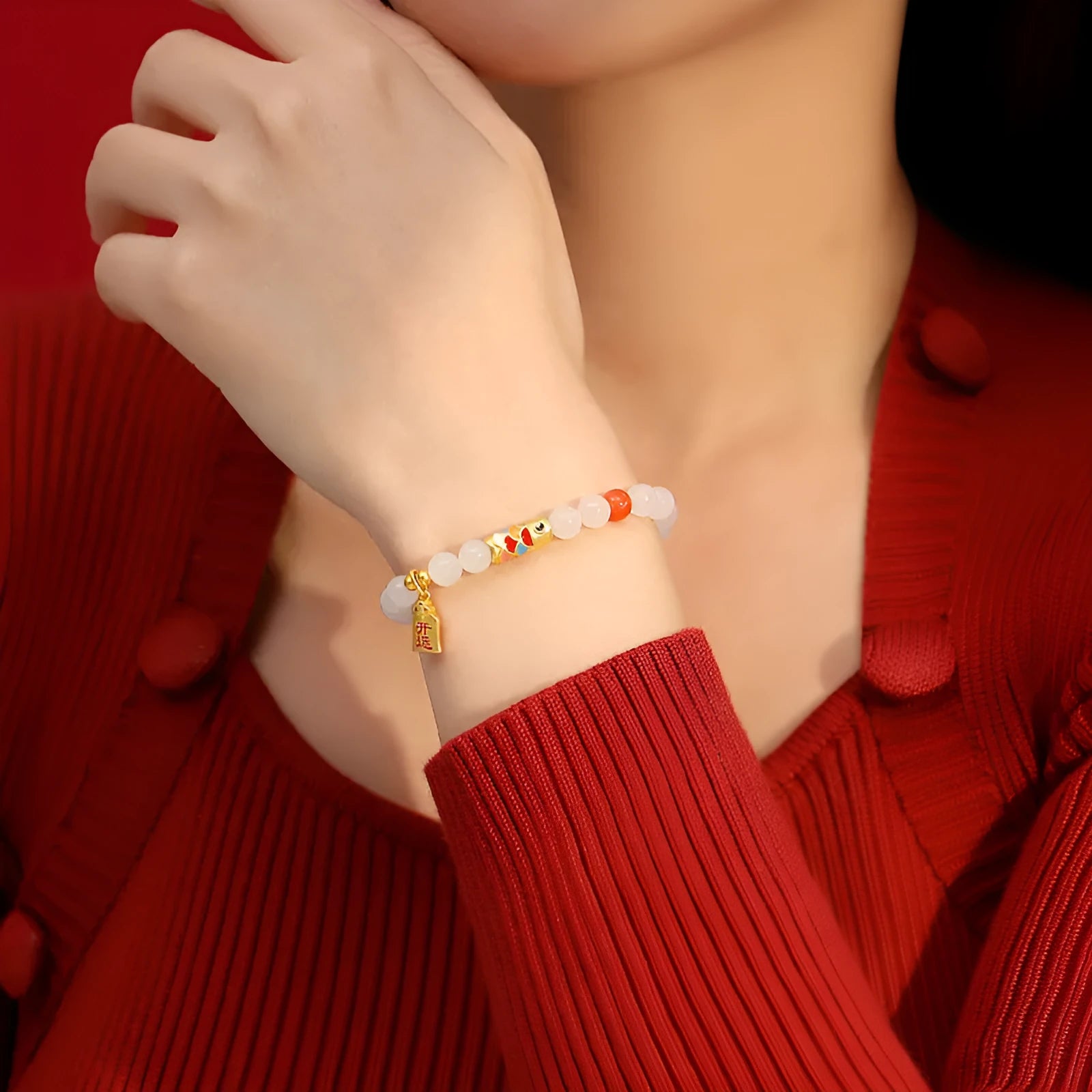 S925 sterling silver bracelet with a 6mm Hetian jade bead and a detailed cold enamel koi fish charm.