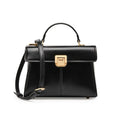 Women's black leather shoulder bag with a vachette clasp, showing its horizontal square shape and adjustable strap.