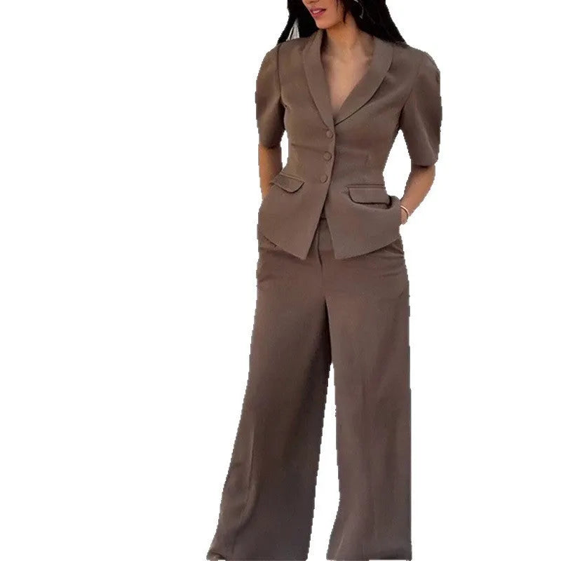 Brown men's slim fit two-piece polyester suit with long sleeves and trousers on a hanger.