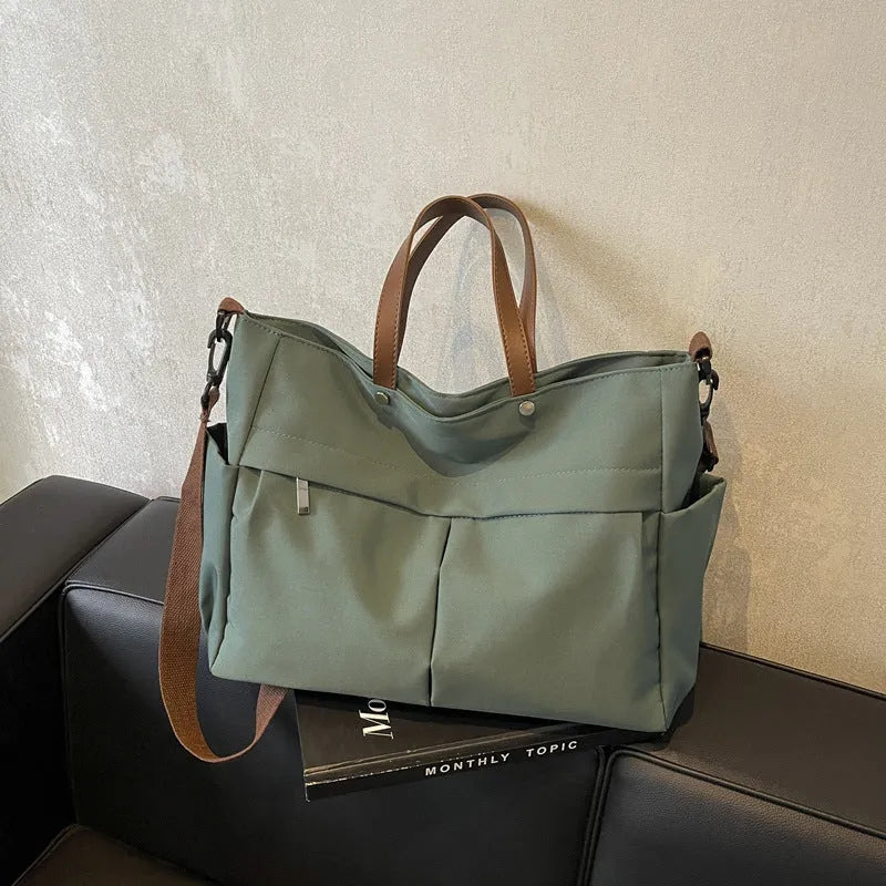 Nylon crossbody tote bag for women in black, grey, white, or green, showing 39x14x28 cm dimensions