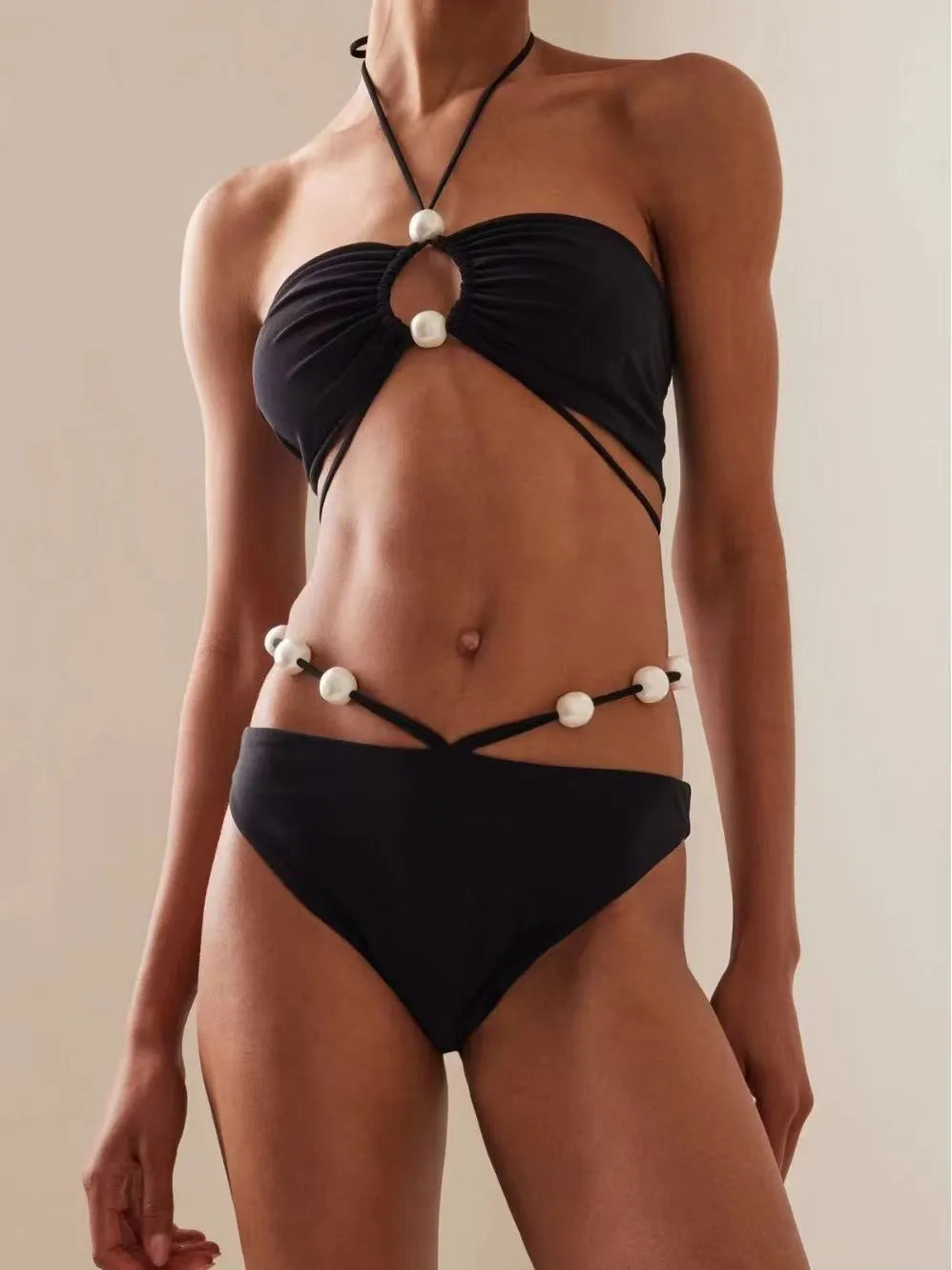 Women's black lace-up bikini swimsuit with adjustable design and quick-drying nylon fabric