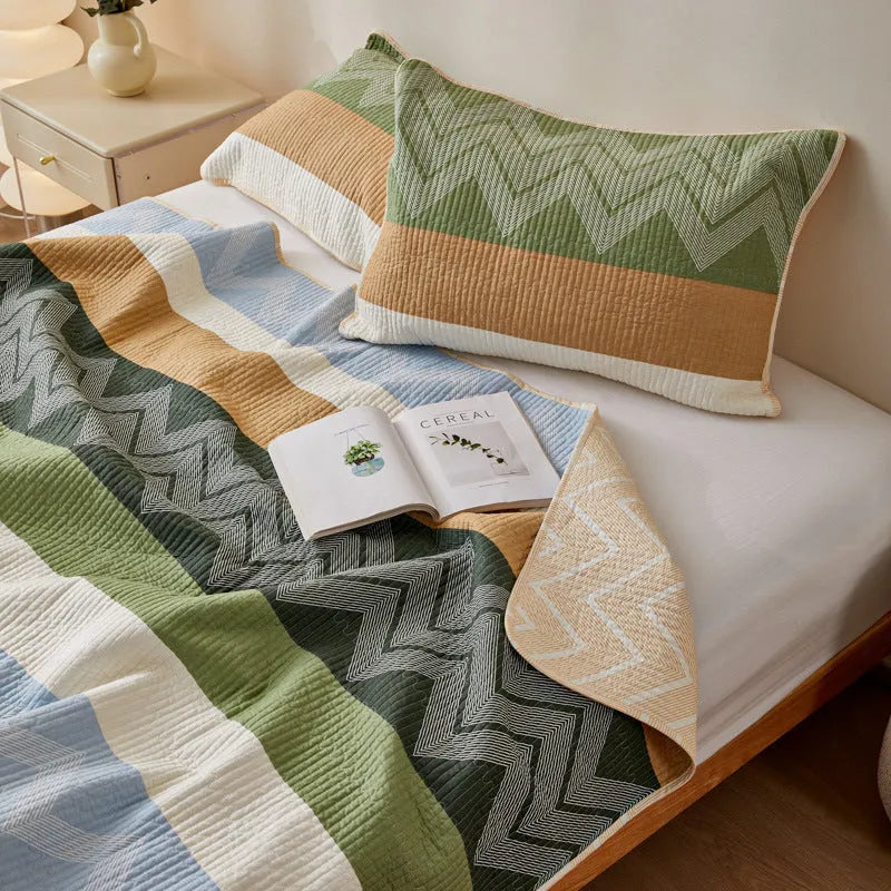 Pure cotton printed bed sheet set in a modern design on a bed, showing bedspread-style drape.