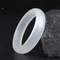 Gao bing jade bracelet in ice-white with flat rod and round rod style options on a wrist