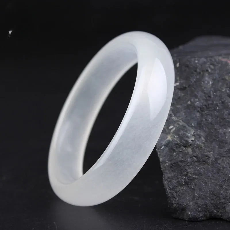 Gao bing jade bracelet in ice-white with flat rod and round rod style options on a wrist