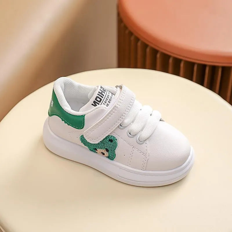 Children's black casual sports shoes with a cartoon bear design on the side, featuring an artificial leather upper and rubber sole.