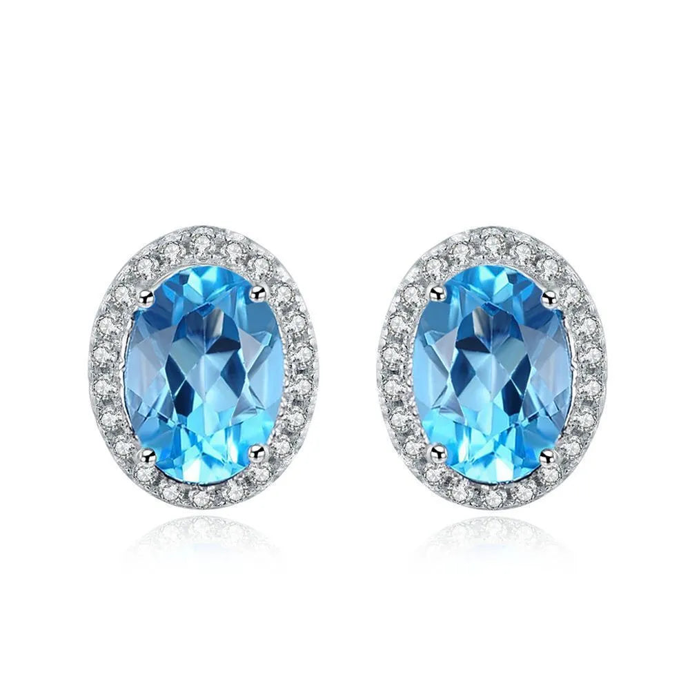 925 sterling silver jewellery set with blue topaz gemstones including earrings, ring, pendant and necklace