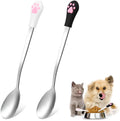 White and black stainless steel pet food spoons with cat paw print and silicone grip