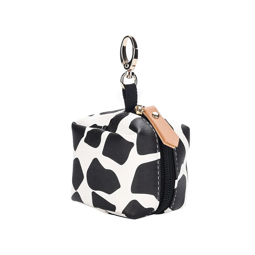 Baby pacifier holder case in PU leather with impervious nylon lining and buckle clip, holds 2 pacifiers, compact 6.35cm size