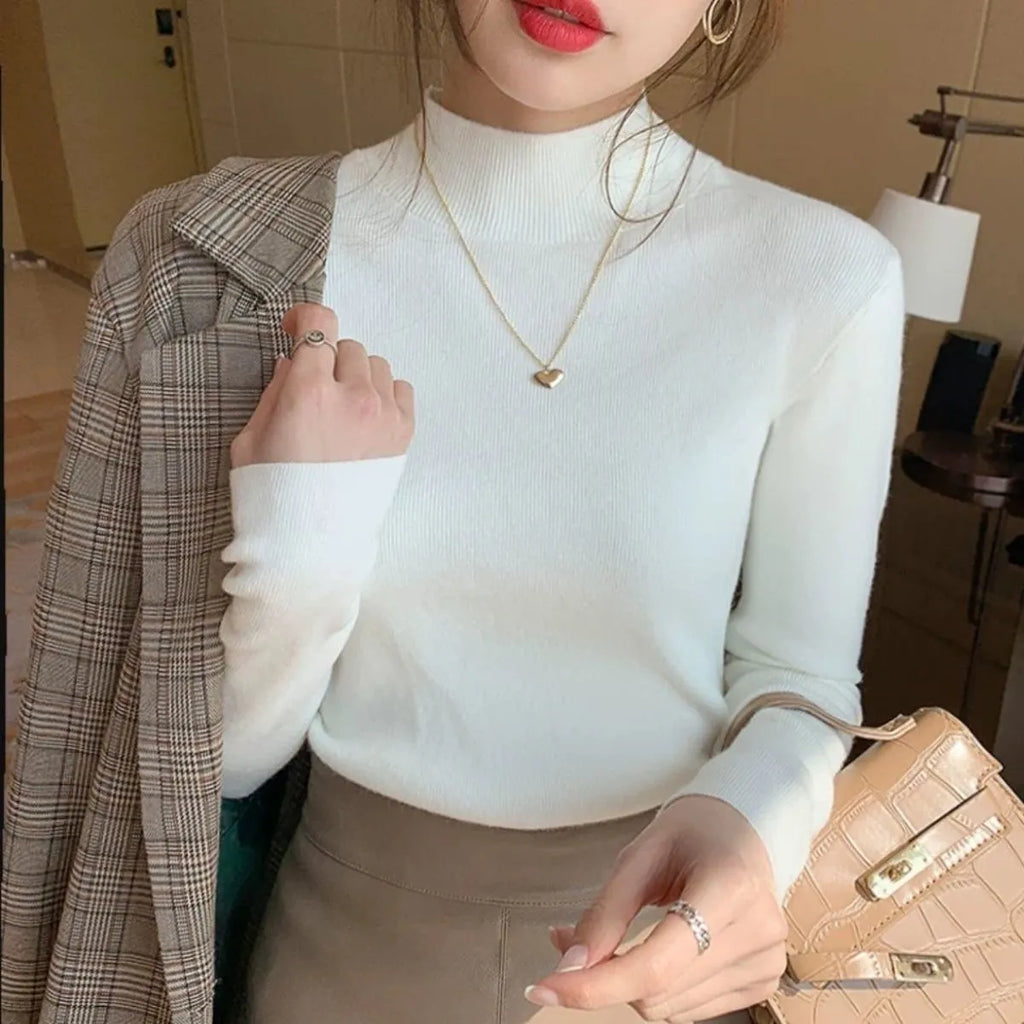 Slim fit viscose inner knitted shirt in apricot colour with long sleeves.