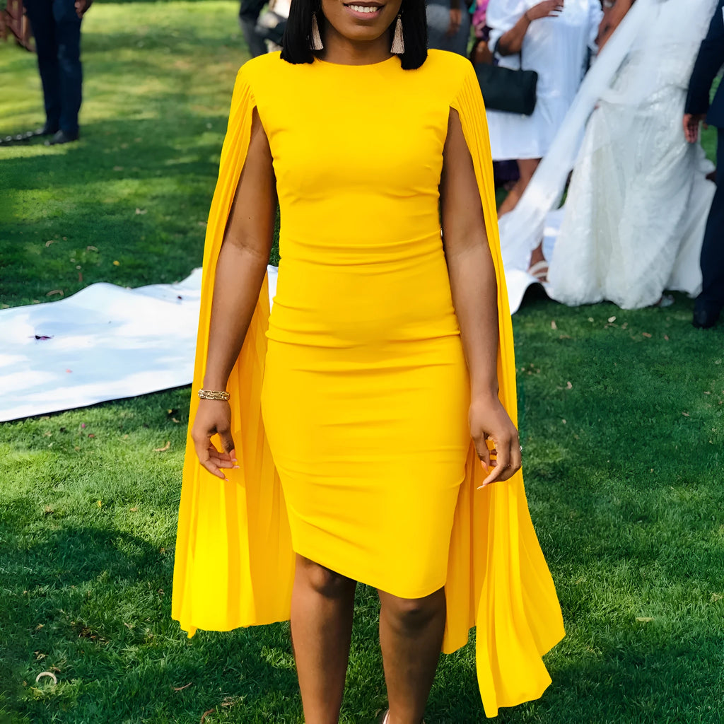 Women's long sleeve yellow evening dress with a round neck, high waist, and pleated shawl detail.