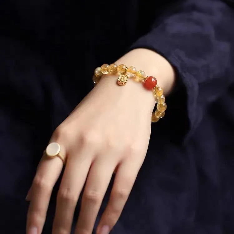 Polished red agate bead bracelet showing gold ruby colour, offered in 6mm, 8mm and 10mm bead sizes.