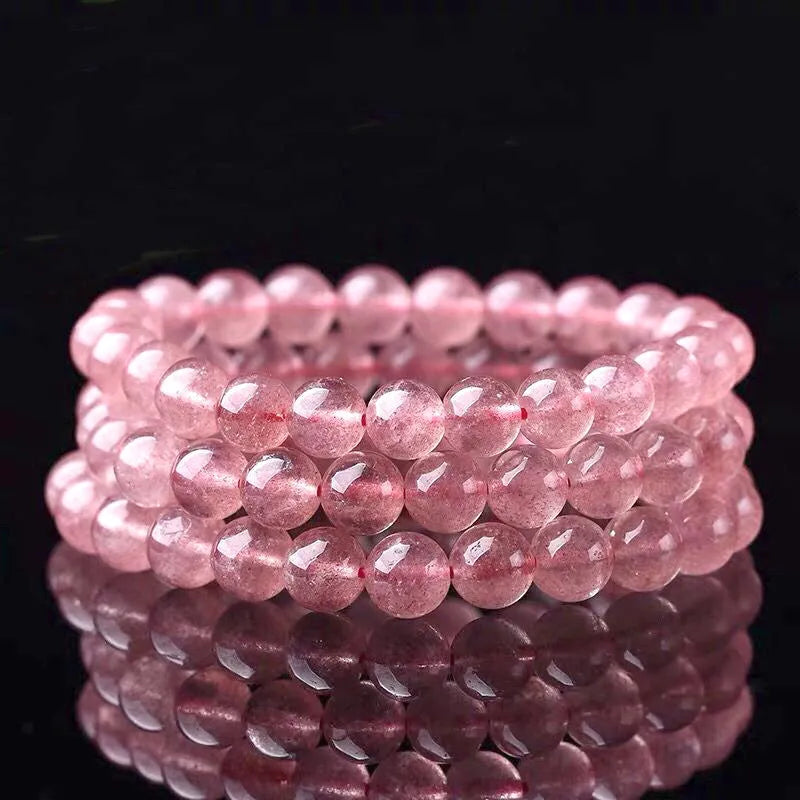 Women's strawberry quartz bracelet showing three bead size options: 6mm, 8mm, and 10mm polished crystal beads.