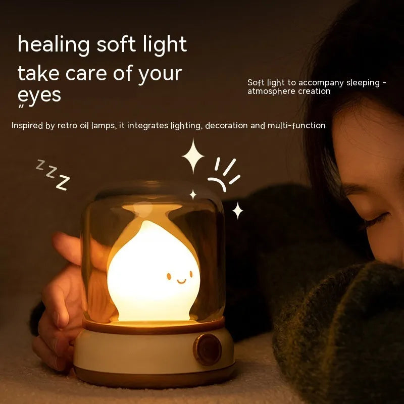 Retro oil lamp style USB rechargeable LED table lamp with dimmable lighting on wooden table