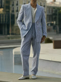 Blue and white striped polyester suit set with blazer and trousers on mannequin