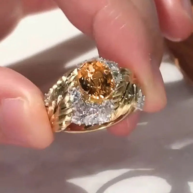 Women's gold copper ring with embossed feather pattern and yellow zircon stones