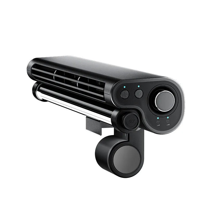 Black clip-on bladeless fan with integrated light attached to a laptop screen.