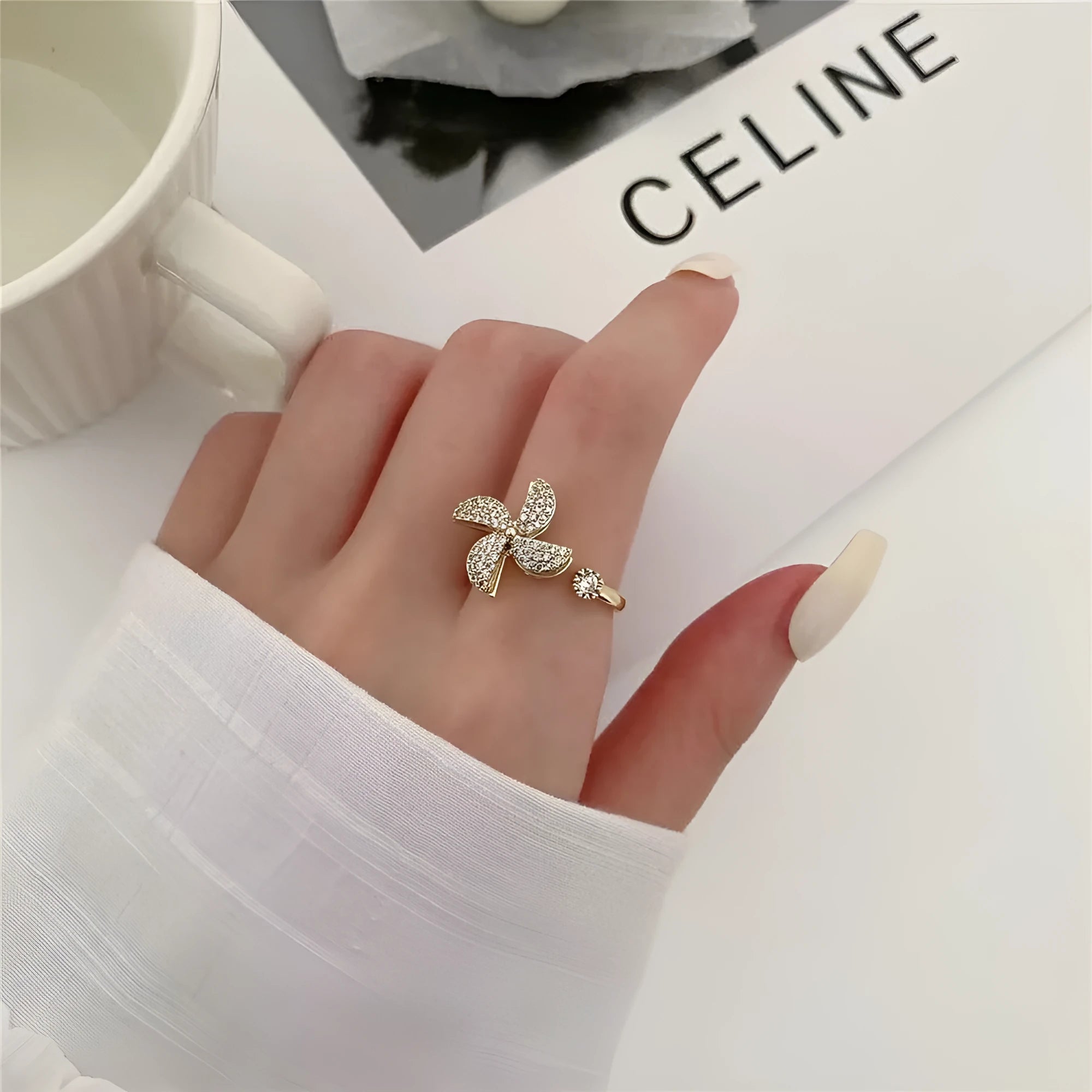 Geometric copper spinner ring with rotating windmill design in gold or silver electroplated finish