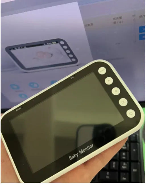 Baby monitor with 4.3-inch LCD screen showing baby in cot, night vision mode, camera with 120-degree rotation