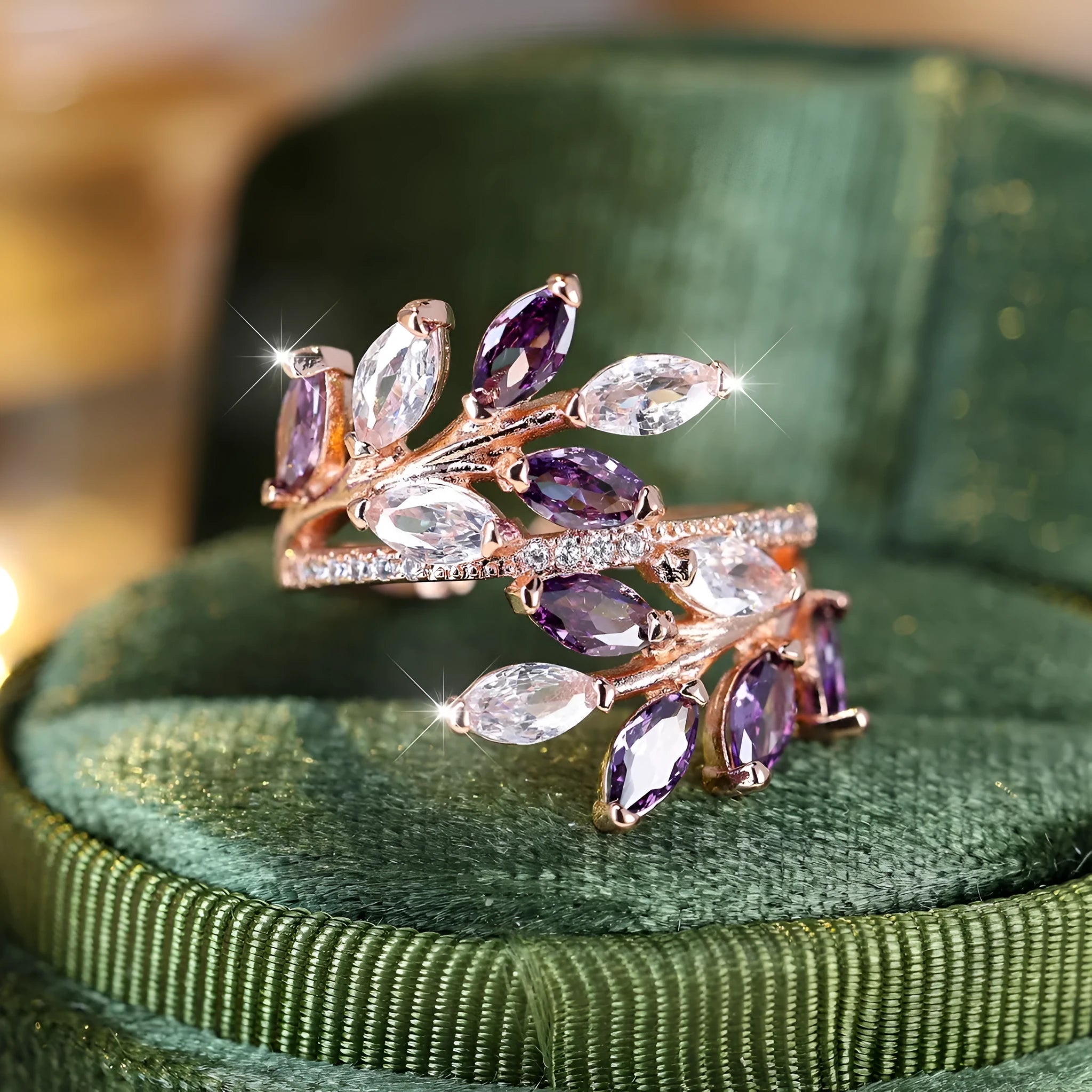 Adjustable copper ring with a detailed leaf design and zircon accents in various colour options.