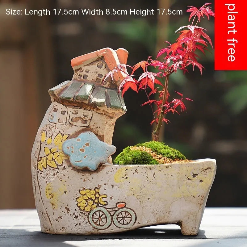 Large calibre ceramic flower pot with hand-painted cute pastoral design on a white background.