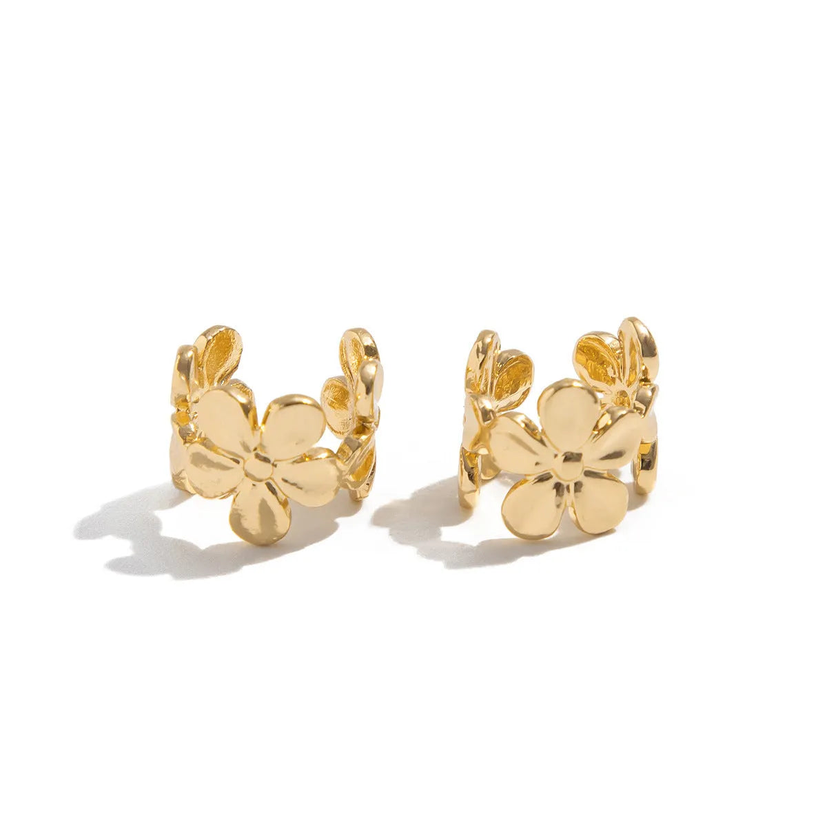 Gold starfish and conch alloy drop hoop earrings for women.