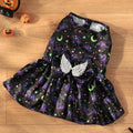 Angel wings Halloween dog costume with bright pumpkin design shown on small dog