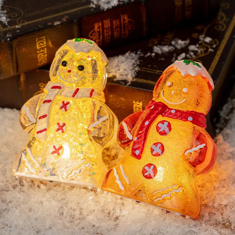 Glowing plastic Christmas ornaments with gingerbread man and snowman designs featuring red, white, and transparent scarves