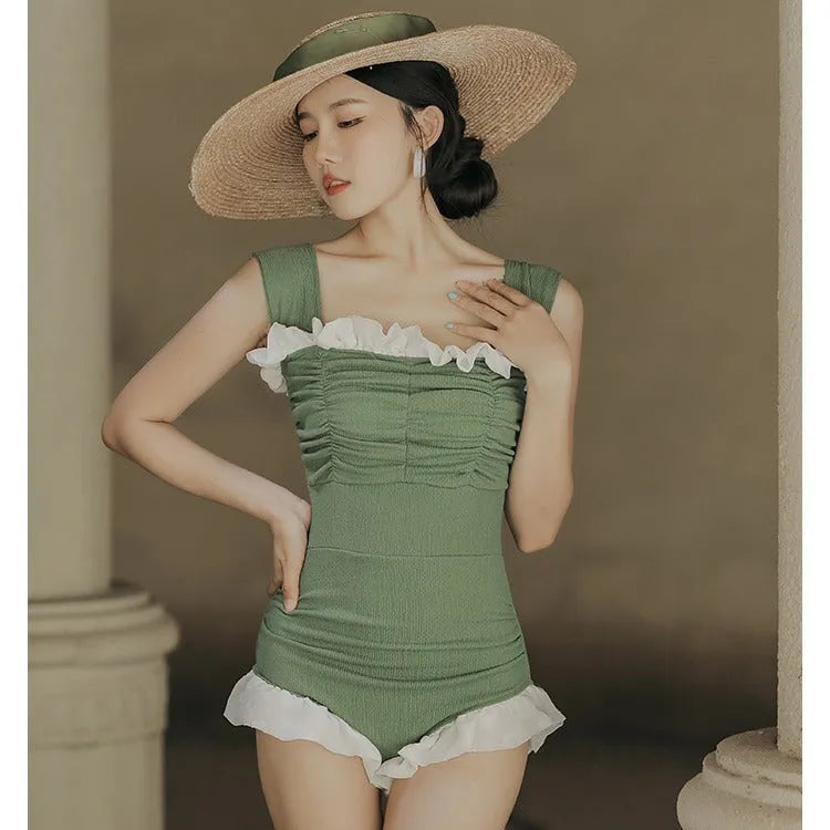 Women's high-waisted one-piece swimsuit in quick-dry polyester, shown in black, green, and pink.