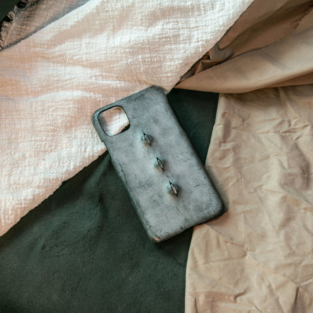 Vintage distressed cowhide leather phone case with textured grip, compatible with iPhone models 15 to 8 Plus, single eye style