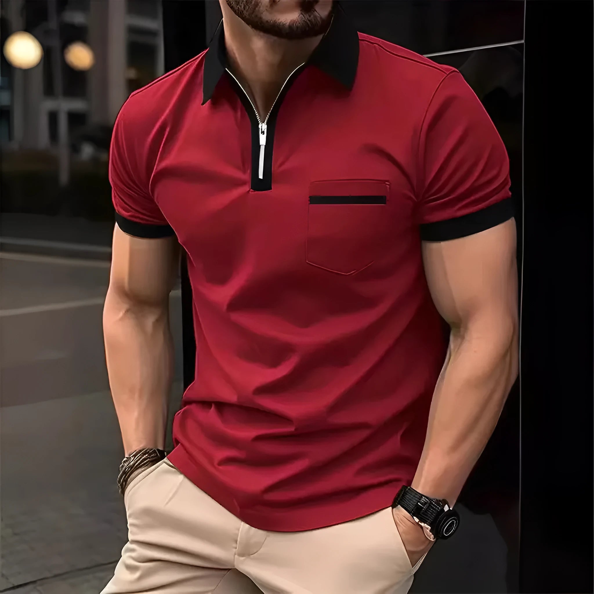 Man wearing a loose-fit casual short sleeve shirt with a chest pocket and contrast collar.