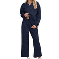 Women's black knitted jacquard suit set with long sleeve top and elastic waist cropped trousers laid flat.