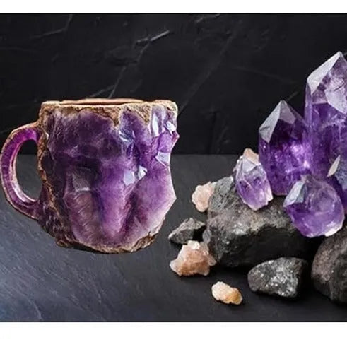 Purple resin coffee mug with handle showing crystal-like transparency on a table.
