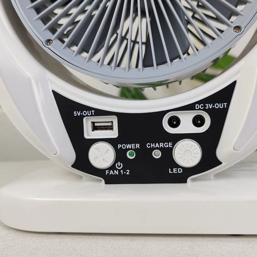Solar charging emergency fan with LED lighting, 6-inch blade, white housing, and solar panel