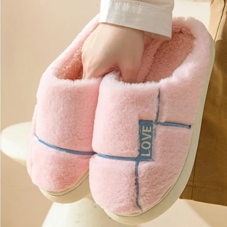 Women's furry indoor slippers in solid colour with plush upper, rubber sole, and wrapped toe, available in multiple colours