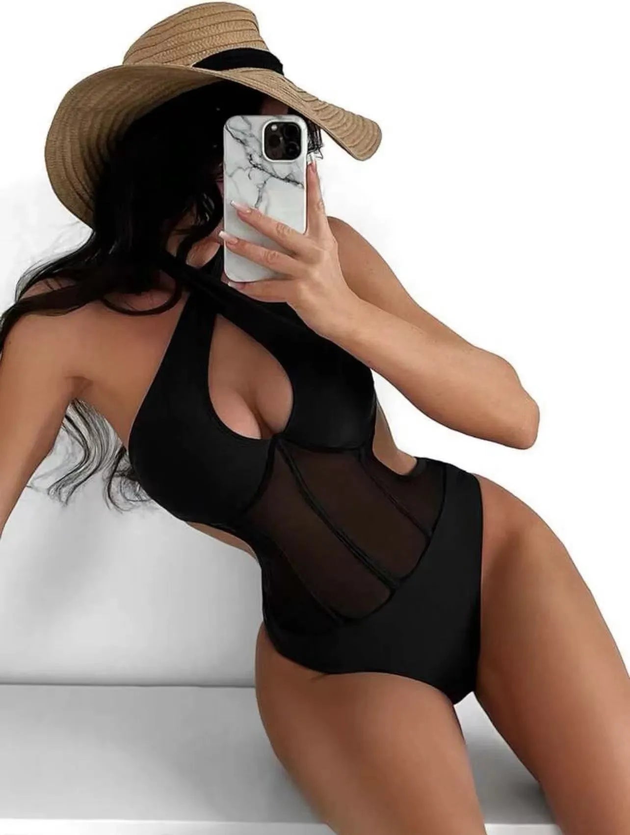 Women's black one-piece swimsuit made from nylon and spandex fabric on a mannequin.