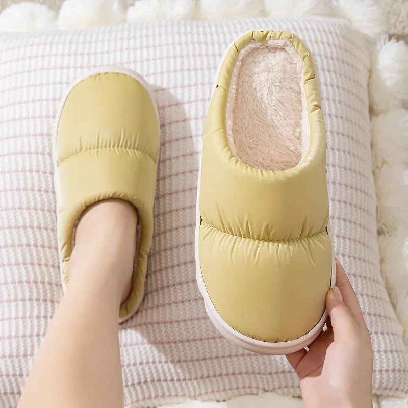 Blue down cotton slippers with thick rubber sole and plush lining, shown from side.