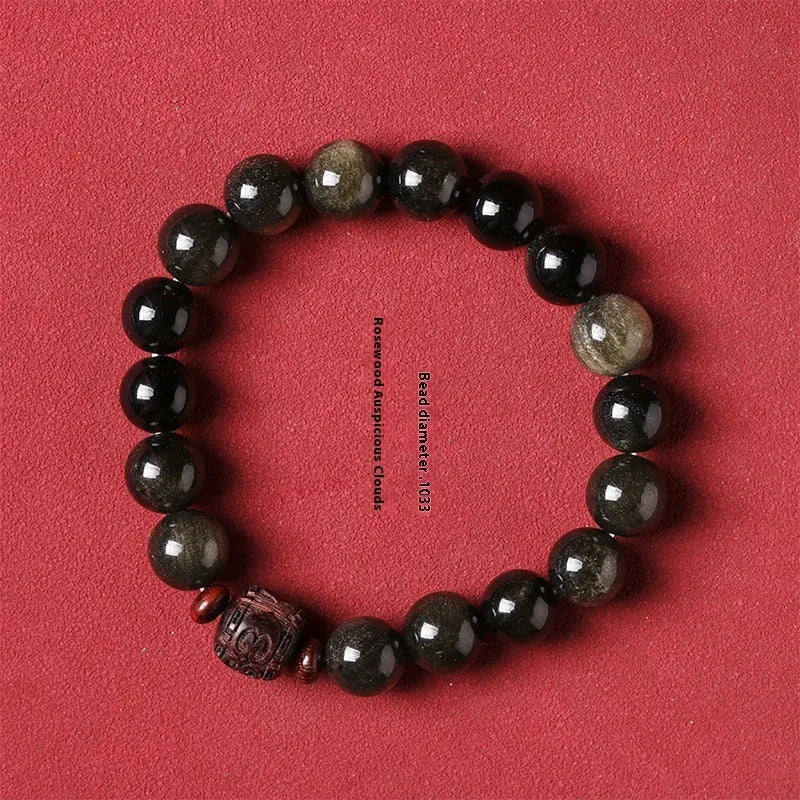 Golden obsidian vintage bracelet with hand-woven construction and national style design elements