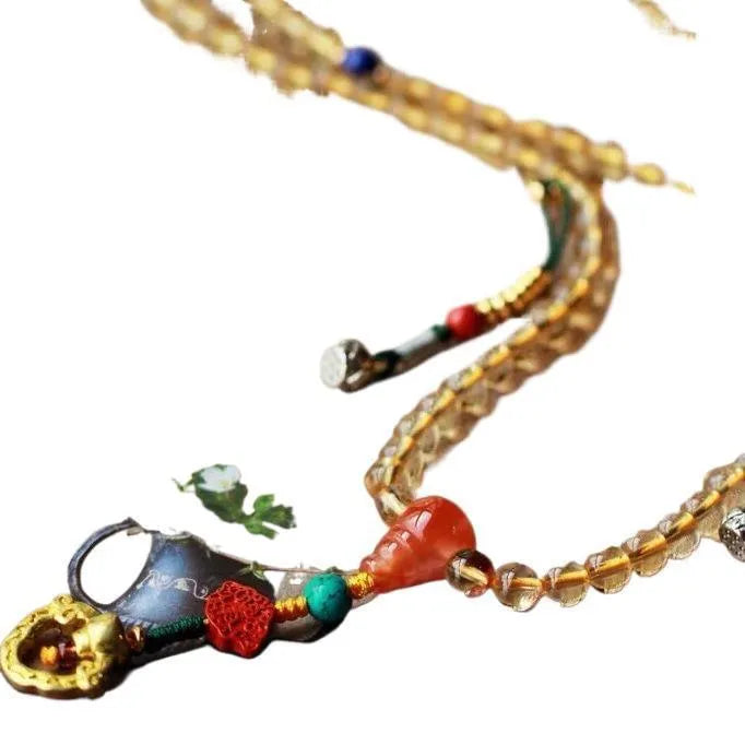Natural Brazilian citrine bracelet with small 1mm red and yellow beads and filament accessories.