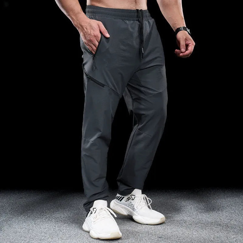 Men's waterproof quick-dry nylon workout pants in multiple colours with mid-waist trousers length design