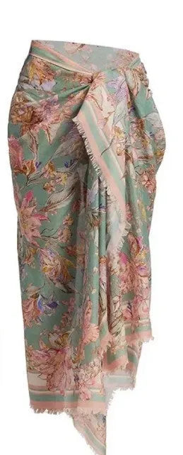 Women's creamy-white floral bikini set with separate skirt on beach