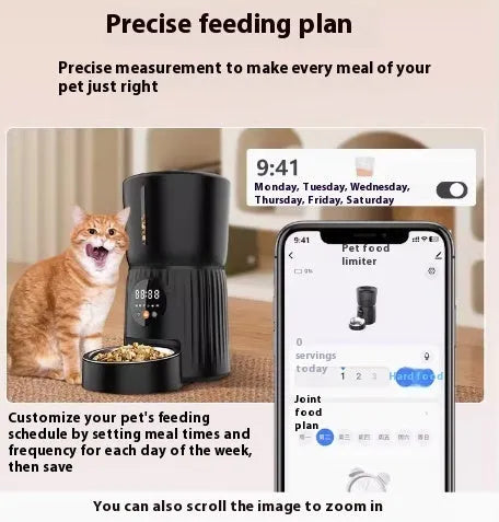 Black automatic pet feeder with digital display and stainless steel bowl on a kitchen floor.