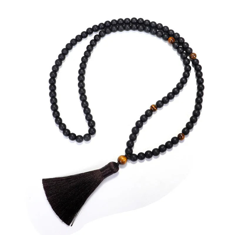 Tigereye stone drop pendant with tassel on long beaded necklace with matching bracelet.