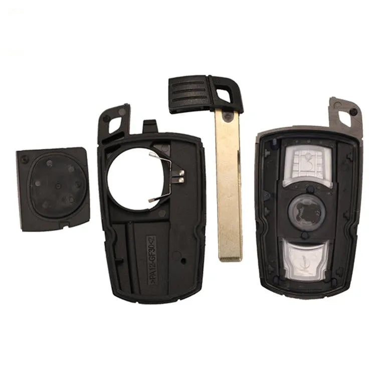 BMW semi-intelligent remote car key fob with three buttons, metal and plastic construction.