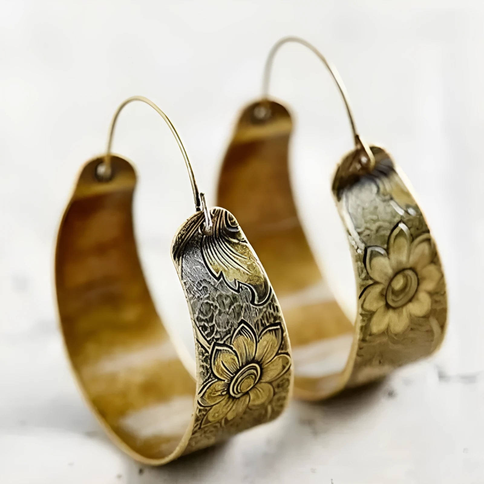 Gold geometric hollow petal earrings with Maillard-inspired creative design for women
