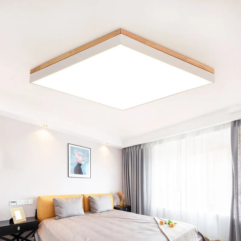Nordic style round ceiling lamp made of solid wood and iron with a white finish.