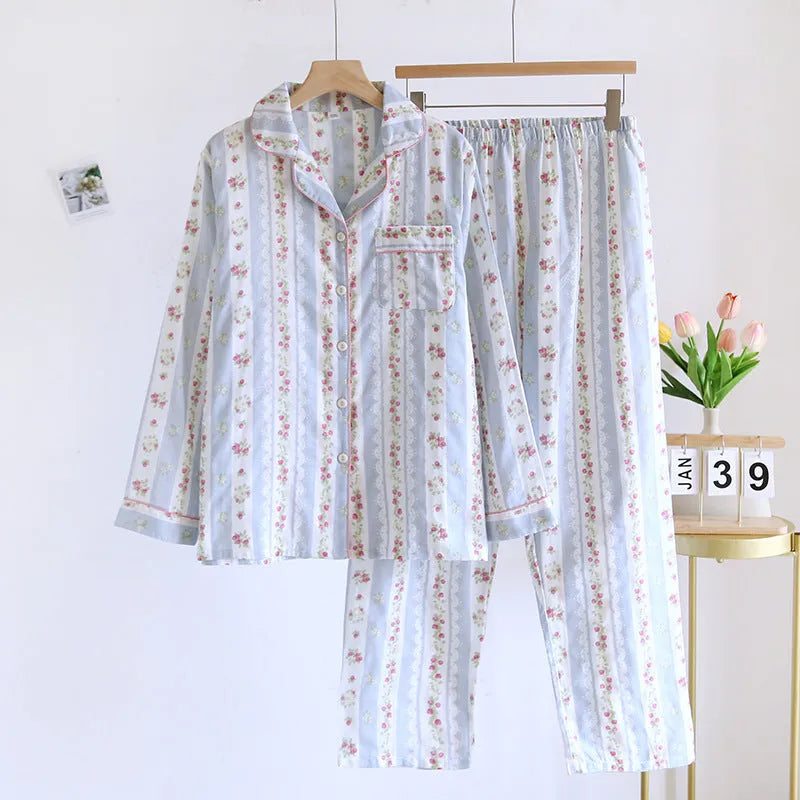 Women's red fruit print cotton gauze long-sleeved top and trousers two-piece lounge set laid flat.