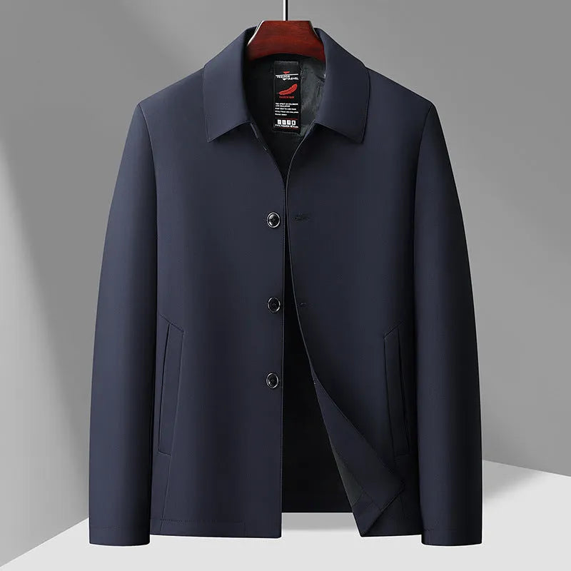 Men's business casual button-down lapel jacket in navy blue, slim fit, wrinkle-resistant, with long sleeves and side pockets.