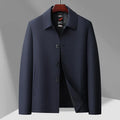 Men's business casual button-down lapel jacket in navy blue, slim fit, wrinkle-resistant, with long sleeves and side pockets.
