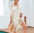Women's apricot crochet patchwork beach dress with half sleeves, shown on a hanger.