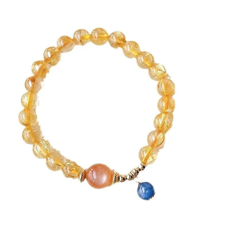 Women's gold rutilated quartz sunstone crystal bracelet with round beads in diamond pattern